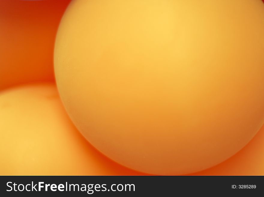 Close-up of orange well-rounded balloons. Close-up of orange well-rounded balloons.