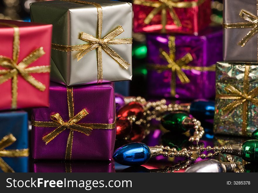 Silver and Purple packages with gold ribbon
