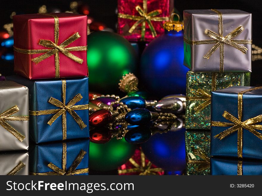 Silver, blue, red, packages with blue and green ornaments. Silver, blue, red, packages with blue and green ornaments