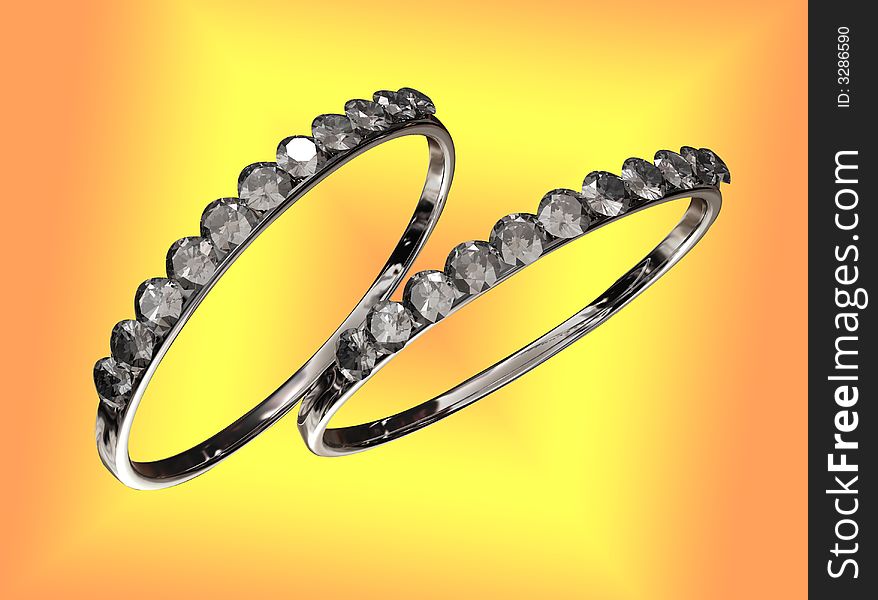 Two rings with diamonds against a colorful background