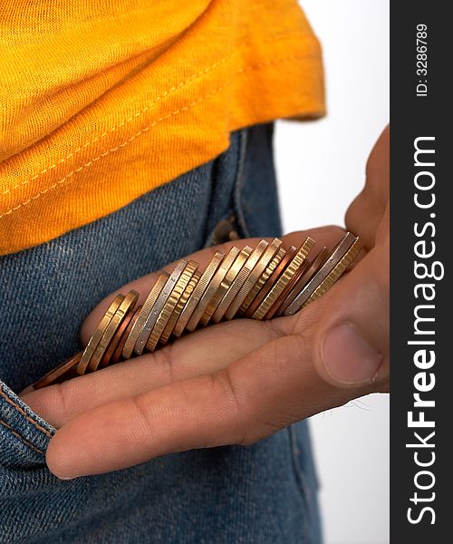 Putting some coins inside the side pockets of a denim trousers