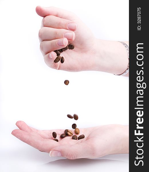 Handful of coffee beans on white background