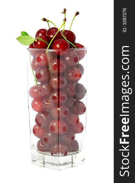 Glass transparent filled with red cherries isolated. Glass transparent filled with red cherries isolated