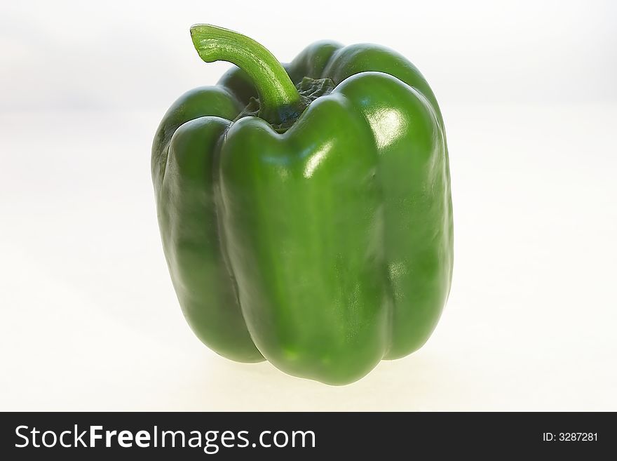 Green peppers on white background.