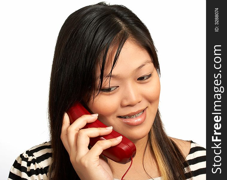 A smiling woman talking on the phone. A smiling woman talking on the phone