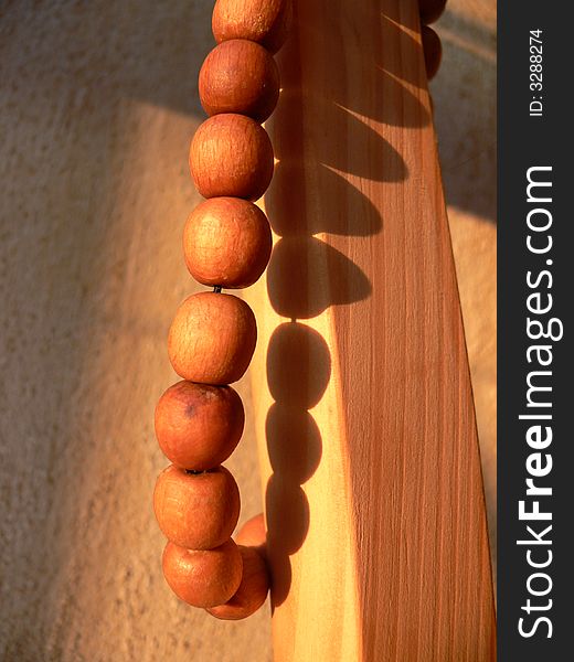 Wood beads in sun in room