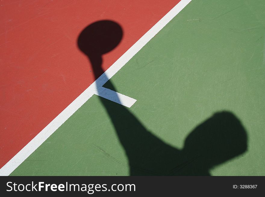A Shadow Basketball player on a green court