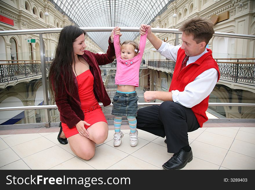 Young family in Moscow universal store