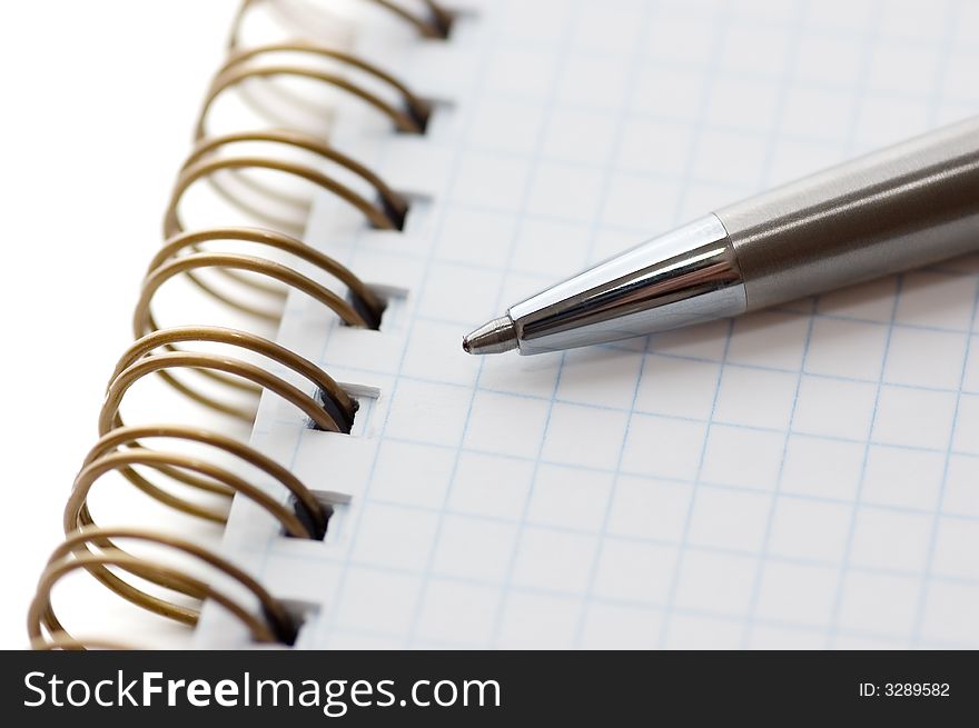 Pen and notepad on a white background. Pen and notepad on a white background