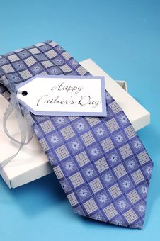 Happy Fathers Day Gift Of A Blue Pattern Check Tie - Vertical. Stock Image Happy Fathers Day Gift Of A Blue Pattern Check Tie - Vertical. Stock Image