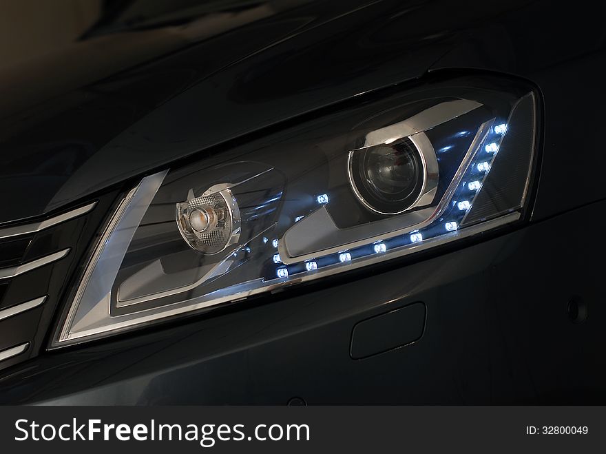 Multifunctional front headlight on a modern car. Multifunctional front headlight on a modern car
