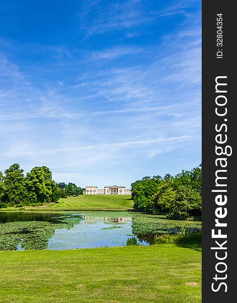 Portrait showing Stowe house and garden and reflection in lake with waterlilies