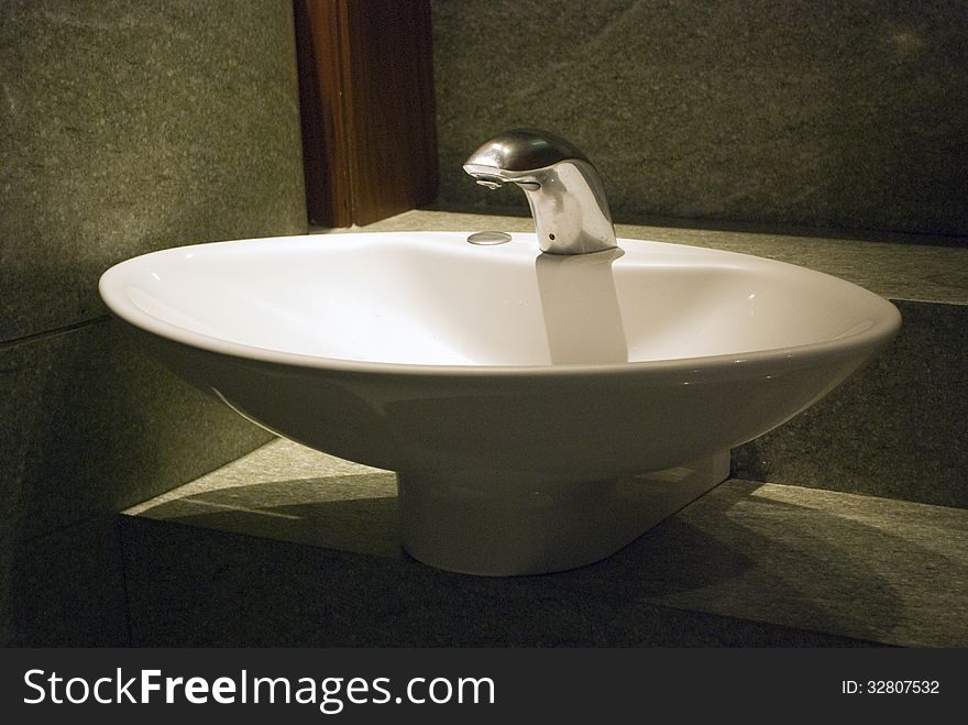 White Wash Basin With Tap And Lighting