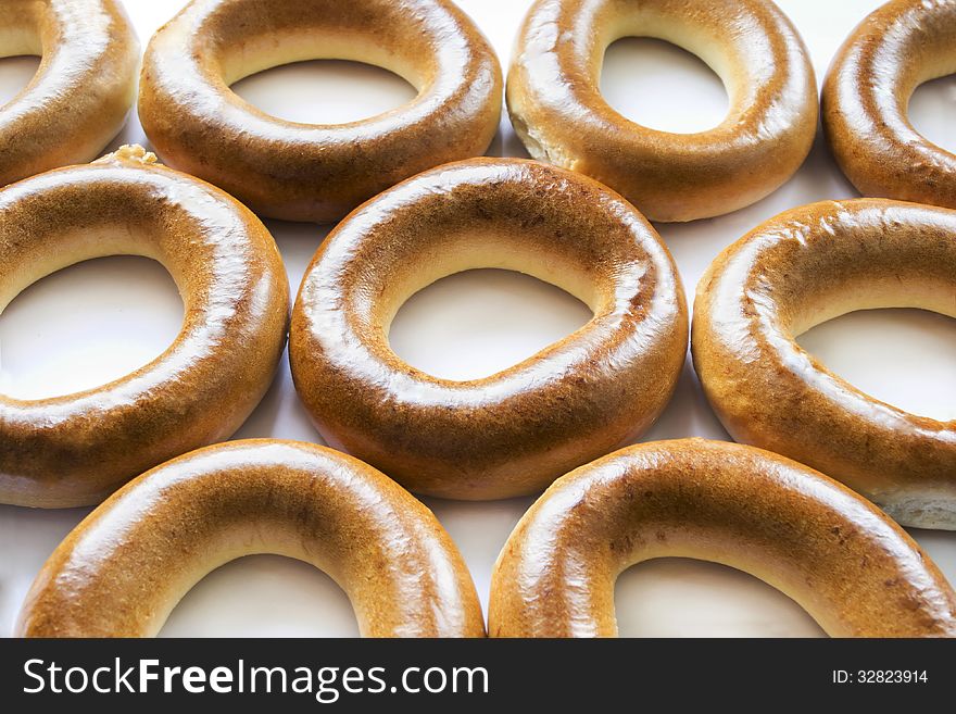 Some fresh delicious golden bagels as a background. Some fresh delicious golden bagels as a background