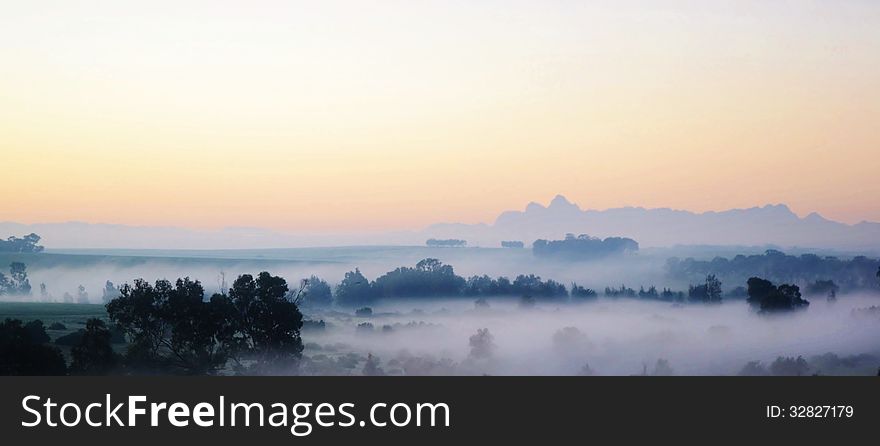 Landscape with morning fog over trees at sunrise. Landscape with morning fog over trees at sunrise