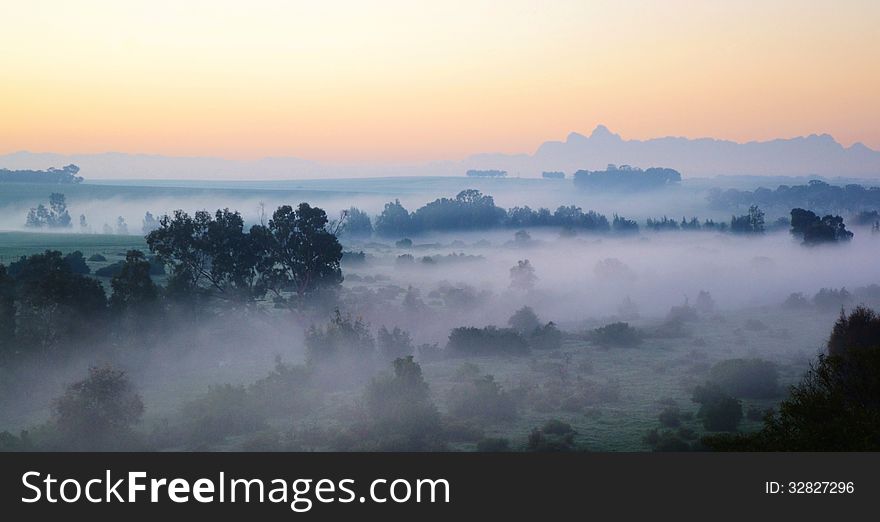 Landscape with morning fog over trees at sunrise. Landscape with morning fog over trees at sunrise