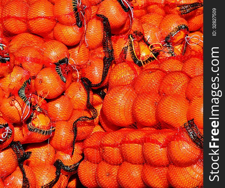 Close up of bags full with oranges. Close up of bags full with oranges