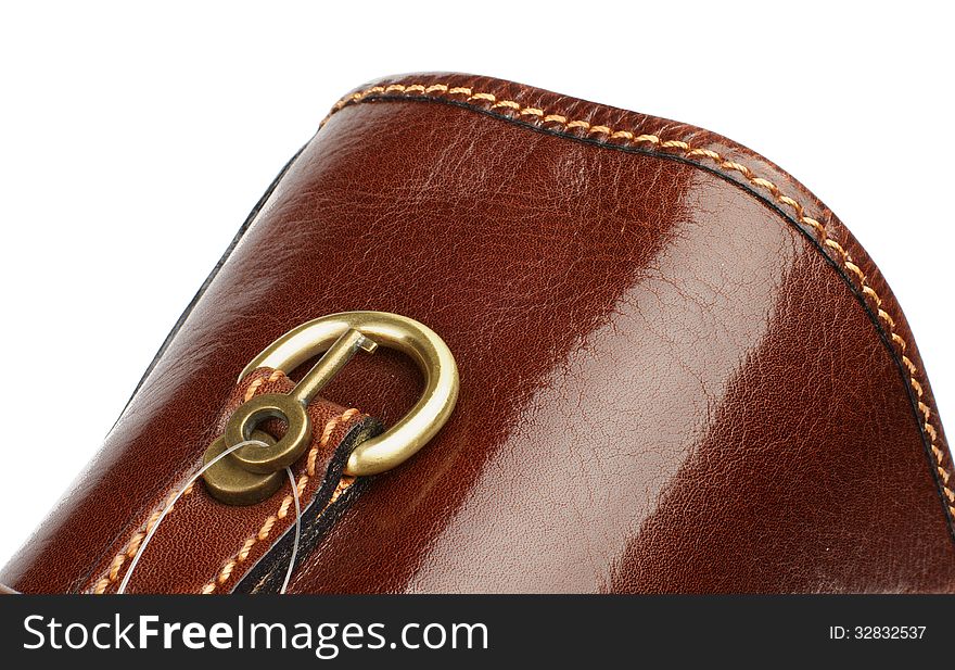 Handle of Brown Leather Briefcase closeup with Gold Details and Little Key on white background. Handle of Brown Leather Briefcase closeup with Gold Details and Little Key on white background