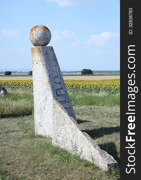 Abstract sculpture with a ball on top of it, representingv the fall of the iron curtain in 1989. It is positiones on a geographic point where the borders of three countries meet. austria, slovakia and hungary, two of them where communist and hat a fence of barbed wire, the iron curtain. Abstract sculpture with a ball on top of it, representingv the fall of the iron curtain in 1989. It is positiones on a geographic point where the borders of three countries meet. austria, slovakia and hungary, two of them where communist and hat a fence of barbed wire, the iron curtain.