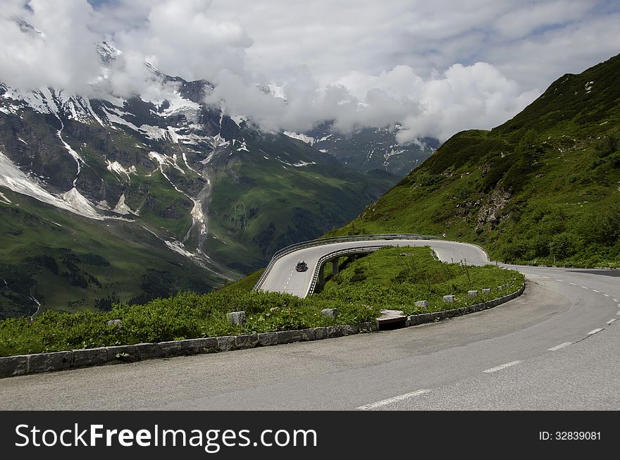 Car climb the road in alps mountain. Car climb the road in alps mountain