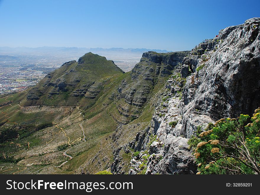 Table Mountain is a flat-topped mountain forming a prominent landmark overlooking the city of Cape Town in South Africa, and is featured in the Flag of Cape Town and other local government insignia. Table Mountain is a flat-topped mountain forming a prominent landmark overlooking the city of Cape Town in South Africa, and is featured in the Flag of Cape Town and other local government insignia