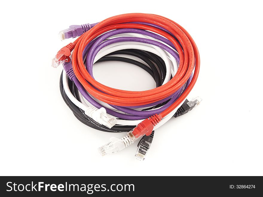 Multi coloured ethernet cables isolated against white