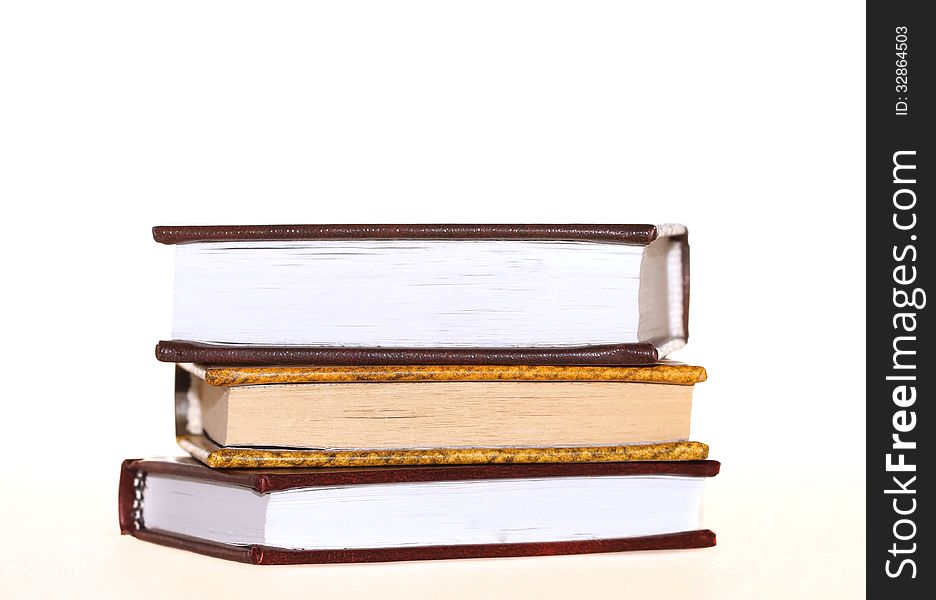 Three books lie over white background. Three books lie over white background