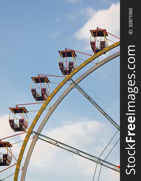 Ferris wheel with a sky on a background