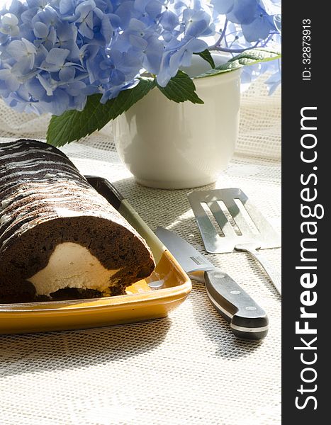 Chocolate cake with mint and blueberries on rectangular plate. From series Chocolate cake