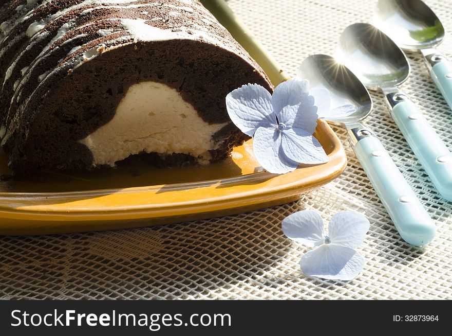 Chocolate cake with mint and blueberries on rectangular plate. From series Chocolate cake. Chocolate cake with mint and blueberries on rectangular plate. From series Chocolate cake