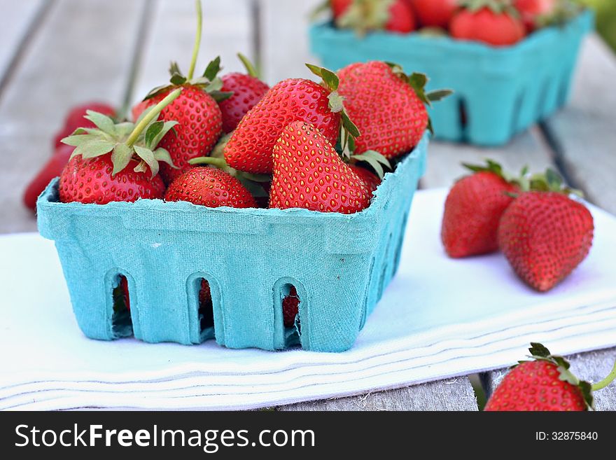 Blue basket filled with strawberries. Blue basket filled with strawberries.