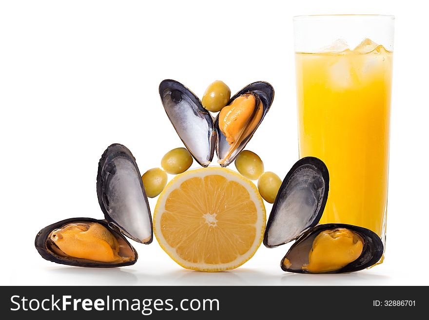 Mussels, lemon, olives and cold fresh orange juice. Mussels, lemon, olives and cold fresh orange juice