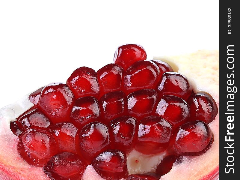 Pomegranate slice isolated on white, close up.