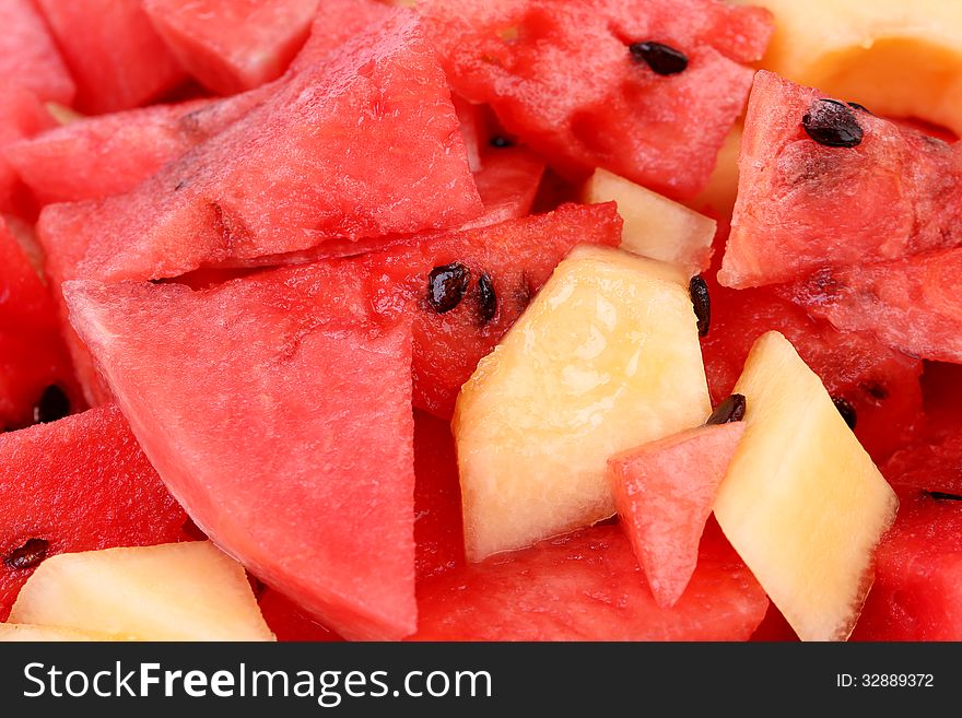 Red watermelon and melon slices on dish. See my other works in portfolio.