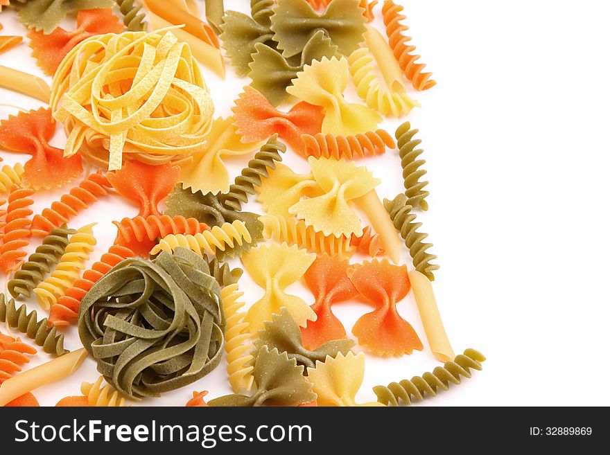 Tagliolini on a background of different pasta. White background.