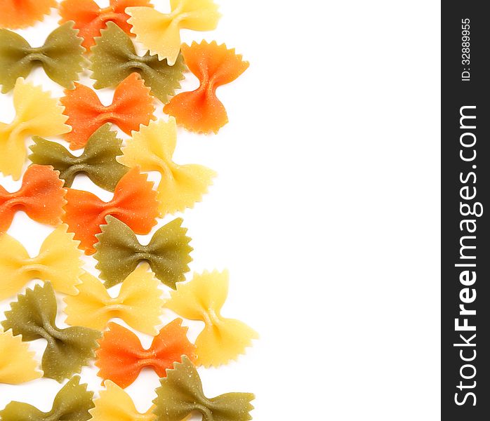 Background of the farfalle pasta three colors. Close up.