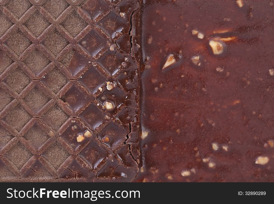 Close up chocolate-coated ice cream sandwich. Macro. Background.