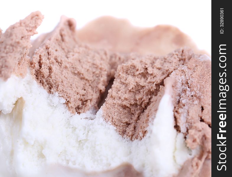 Bitten vanilla and chocolate ice cream. Macro.