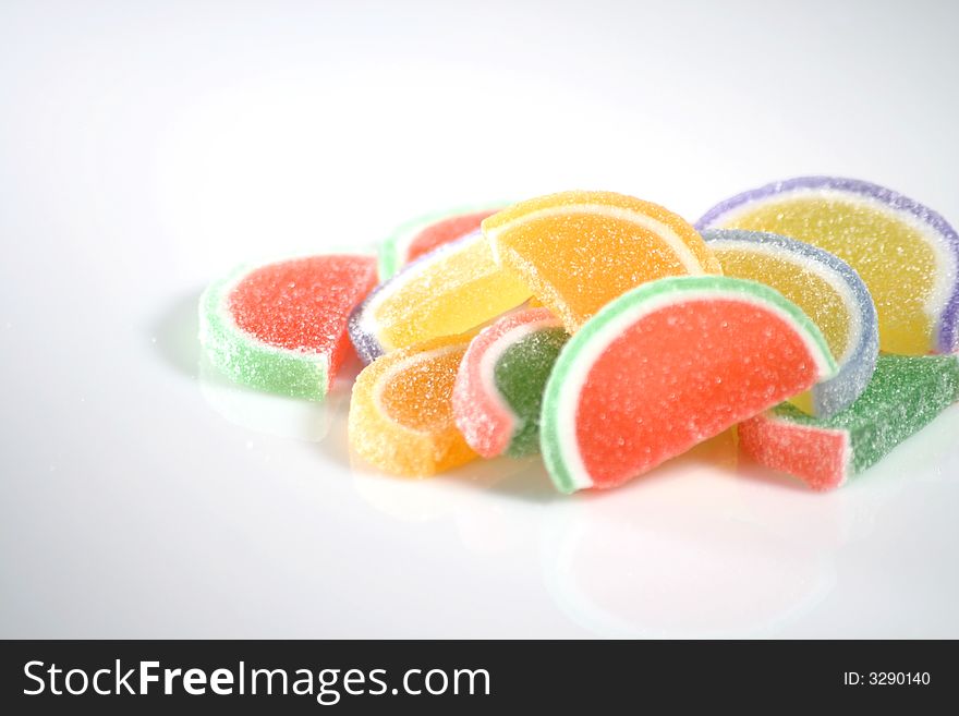 Pile of multiple sugar coated fruit slice gummy candy. Pile of multiple sugar coated fruit slice gummy candy