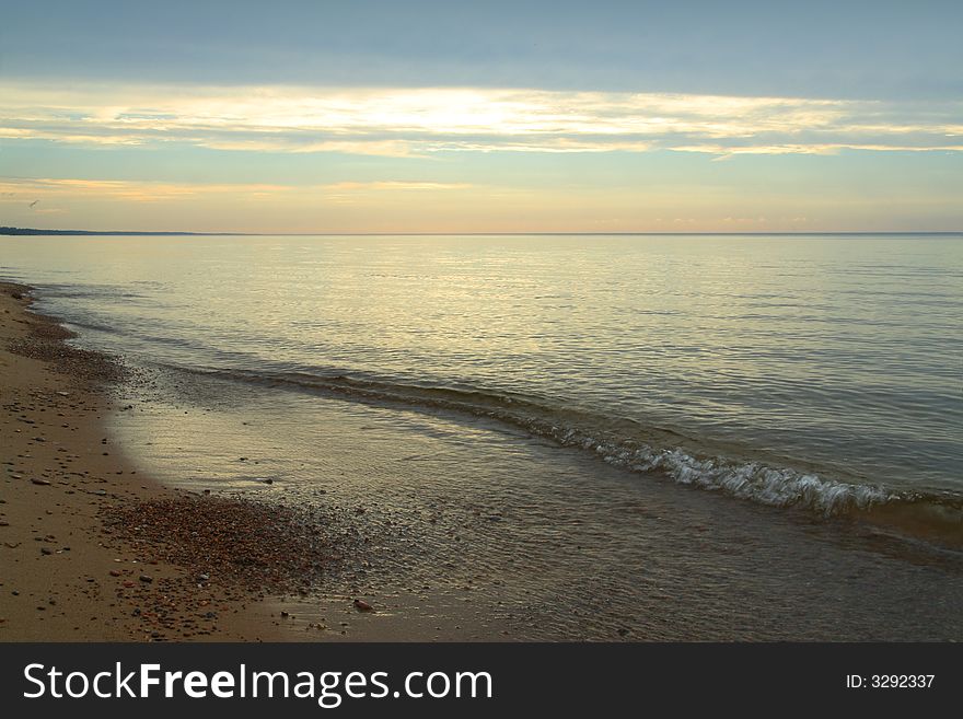 Serene sunset on the sea shore. Serene sunset on the sea shore