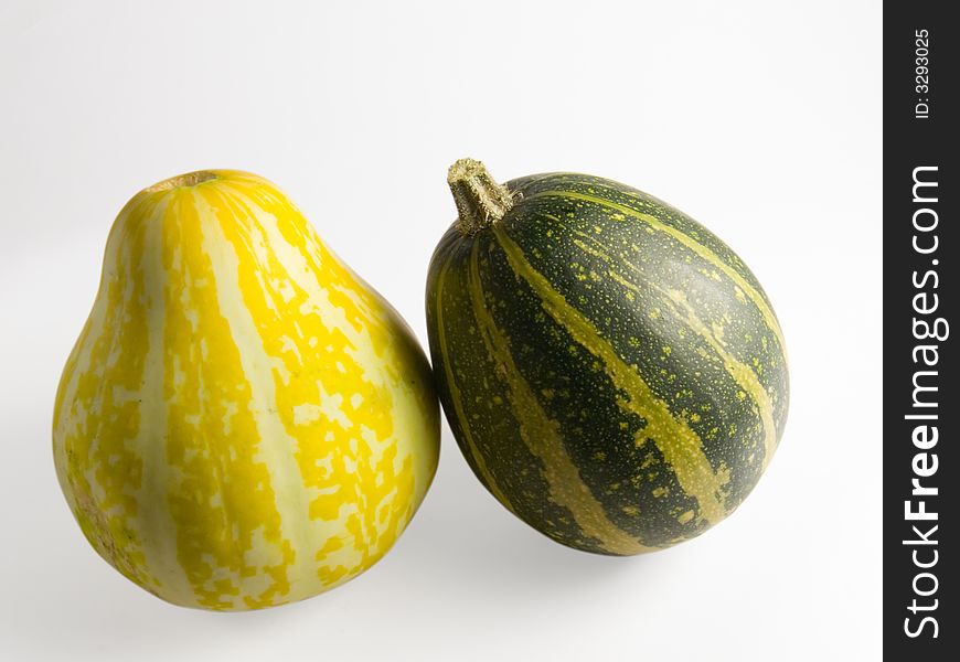 Two decorative pumpkins, yellow and green. Working path included.