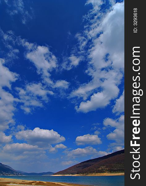 Lake mavrovo sandy beaches with blue sky and clouds. Lake mavrovo sandy beaches with blue sky and clouds