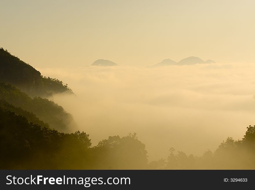 Sea of clouds in the morning.Golden clouds floated surround the mountain.It was shot in Yan-Dang Hill