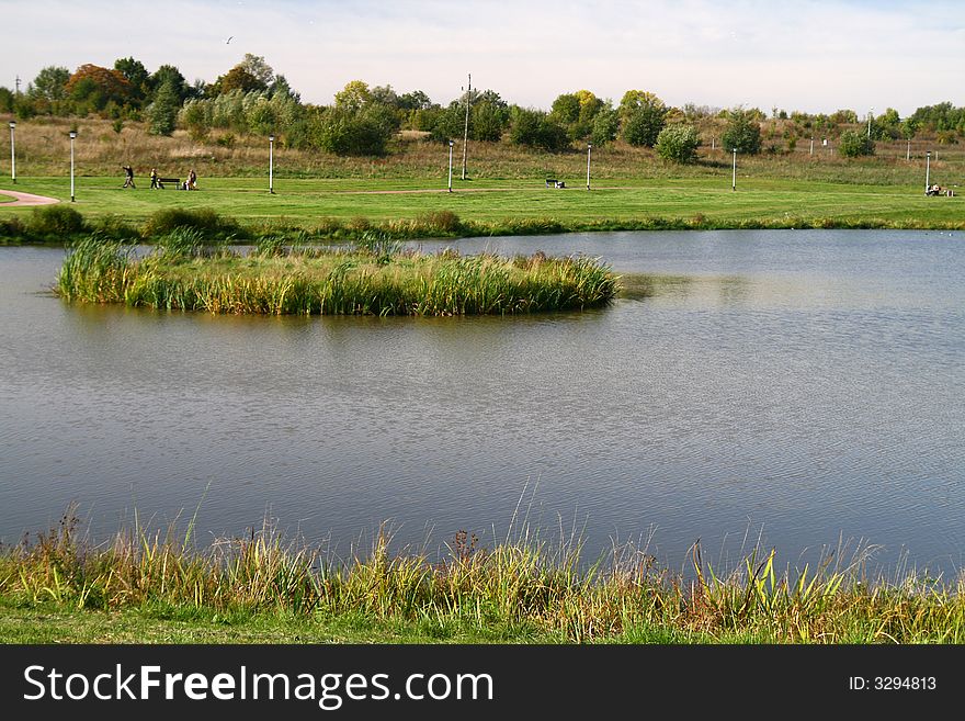 City rest... island on the pond, grass, rural landscape,. City rest... island on the pond, grass, rural landscape,