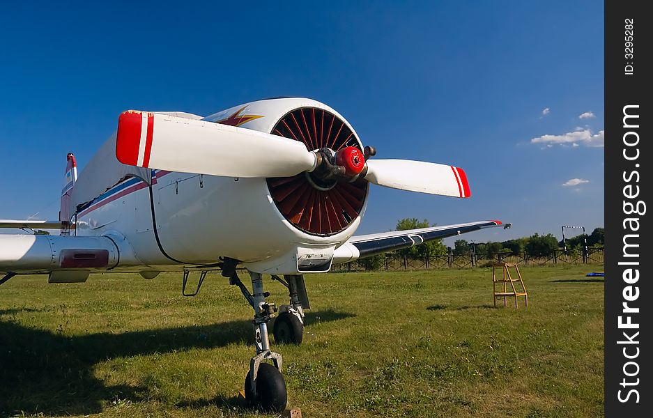 Small sport airplane on land