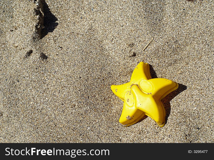 Toys in the black sea sands. Toys in the black sea sands