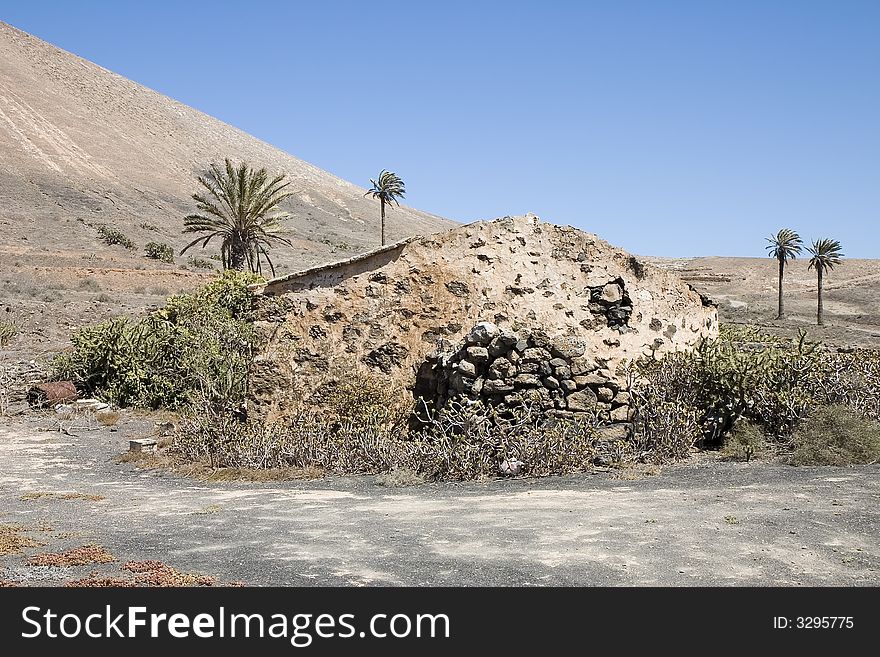 Rustic house in an arid landscape in Lanzarote, Canary Islands, Spain. Rustic house in an arid landscape in Lanzarote, Canary Islands, Spain