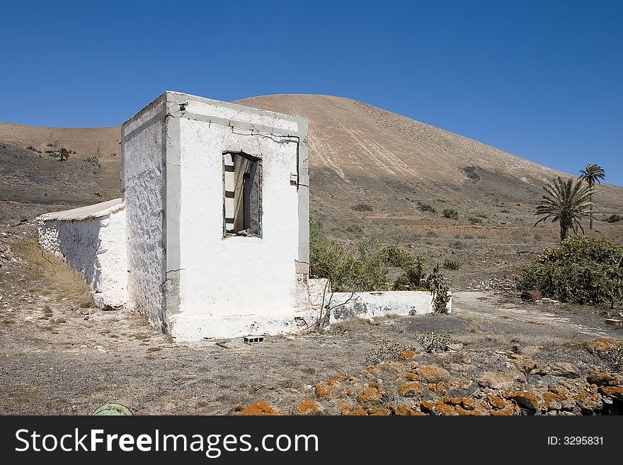 Rustic house in an arid landscape in Lanzarote, Canary Islands, Spain. Rustic house in an arid landscape in Lanzarote, Canary Islands, Spain