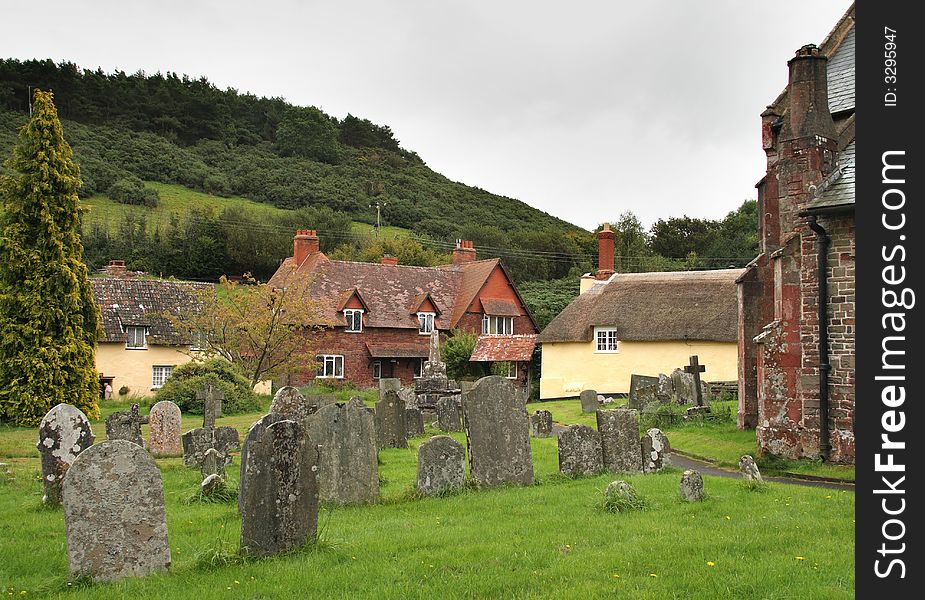 Rural English Village and Churchyard with Hills in the backgrund. Rural English Village and Churchyard with Hills in the backgrund