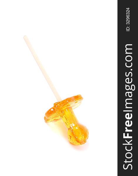 Sweet yellow lollipop on the white background